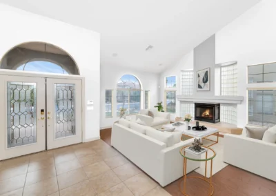 Virtually staged living room with white decor, property photo editing for MLS listings.