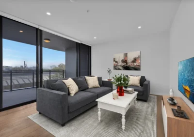 Virtually staged living room with modern furniture, real estate photo editing by Outsource Infotech