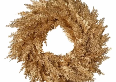 Complex image masking service for a detailed gold holiday wreath, isolated on a white background.