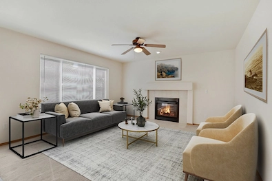 Digitally staged living room with a fireplace, designed to showcase interior potential for listings.