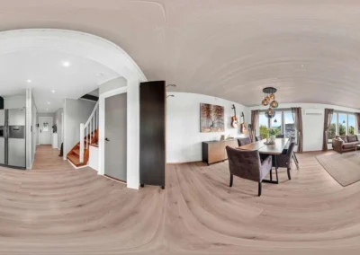 Professional 360 interior panorama of an open-plan home with warm lighting and seamless stitching.