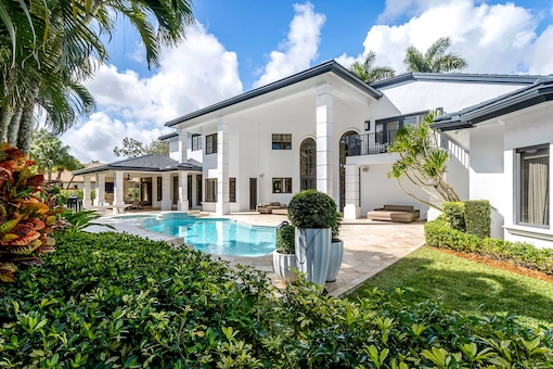 Bright, color-corrected bedroom featuring manual HDR blending and clear window views.